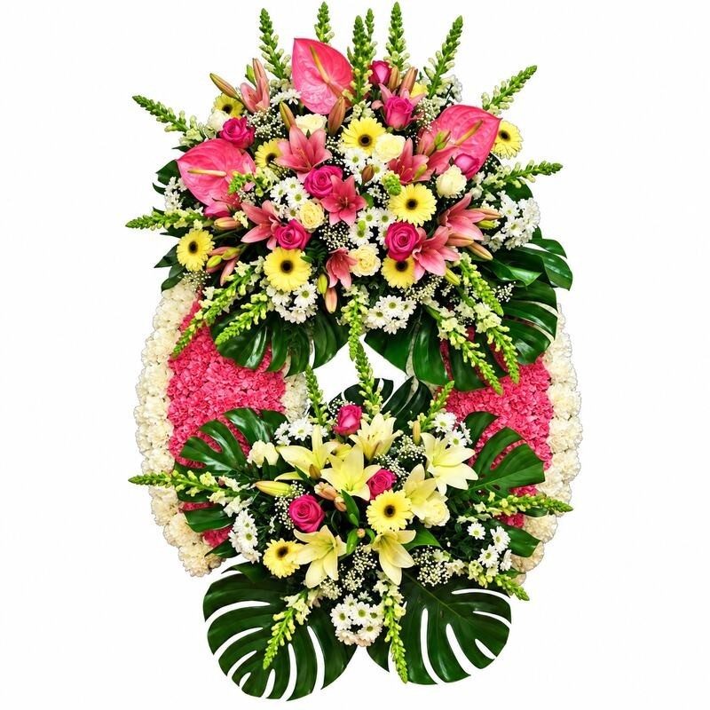 Corona de flores rosas con detalles amarillos "Cuidado" MC18